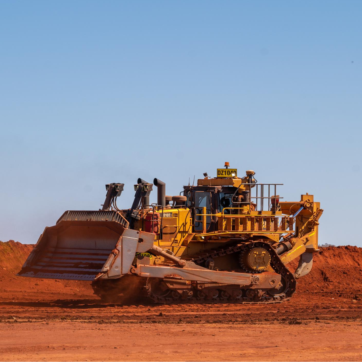 Dozer cutting edges and wear parts installed on Caterpillar mining dozer